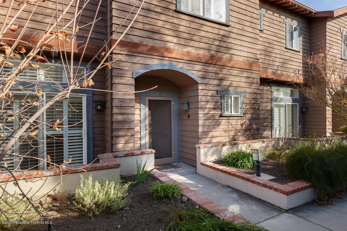 306 Alpine Street, Unit 3 Pasadena, CA 91106 - Photo 2 of 26 a front view of a house with a yard