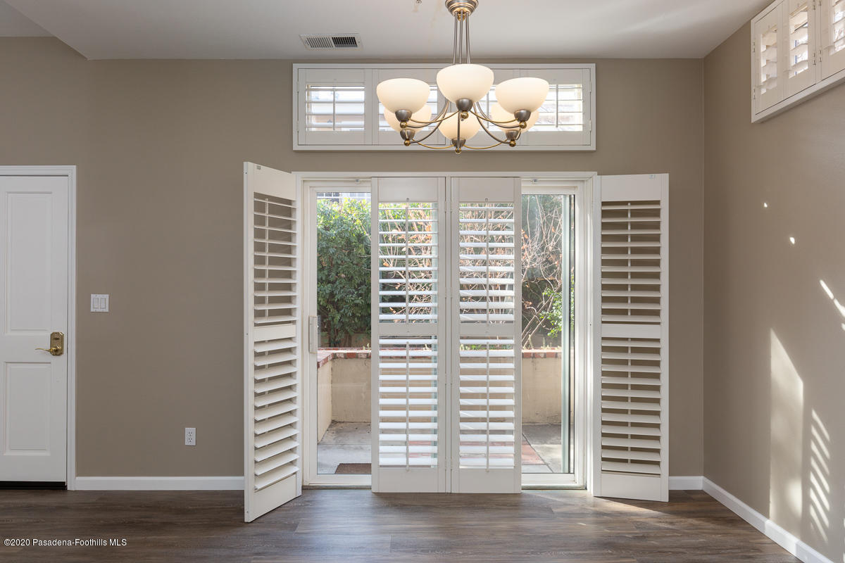 306 Alpine Street, Unit 3 Pasadena, CA 91106 - Photo 4 of 26 a view of a dining room with wooden floor