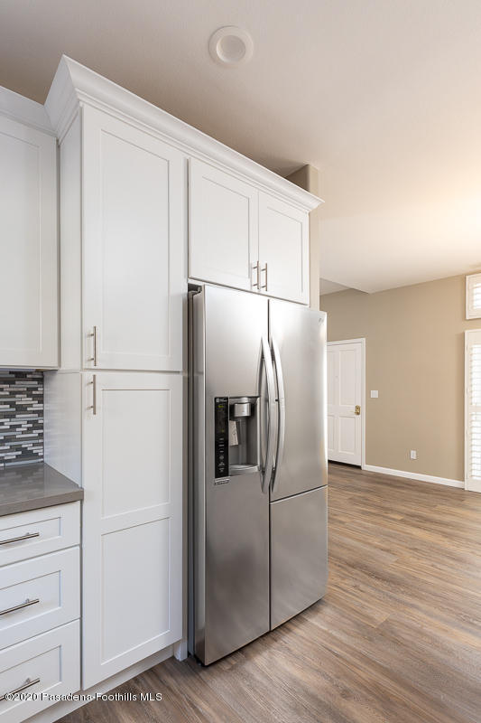 306 Alpine Street, Unit 3 Pasadena, CA 91106 - Photo 10 of 26 a metallic refrigerator freezer sitting in a kitchen