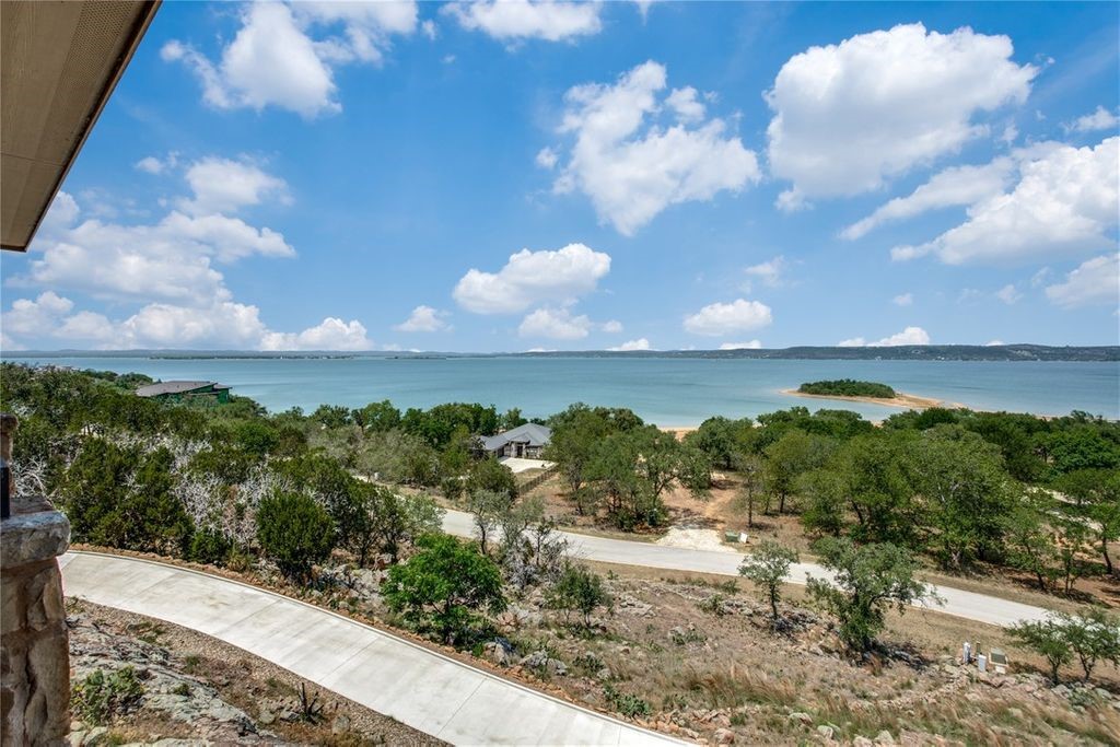 214 Peninsula Drive Burnet, TX 78611 - Photo 14 of 44 a view of a lake in middle of a town