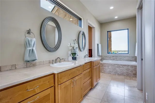 a bathroom with a granite countertop sink a mirror and a