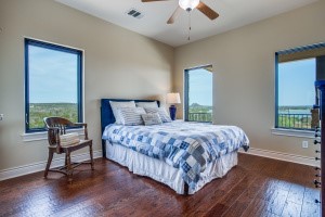 214 Peninsula Drive Burnet, TX 78611 - Photo 35 of 44 a bedroom with a bed and a window