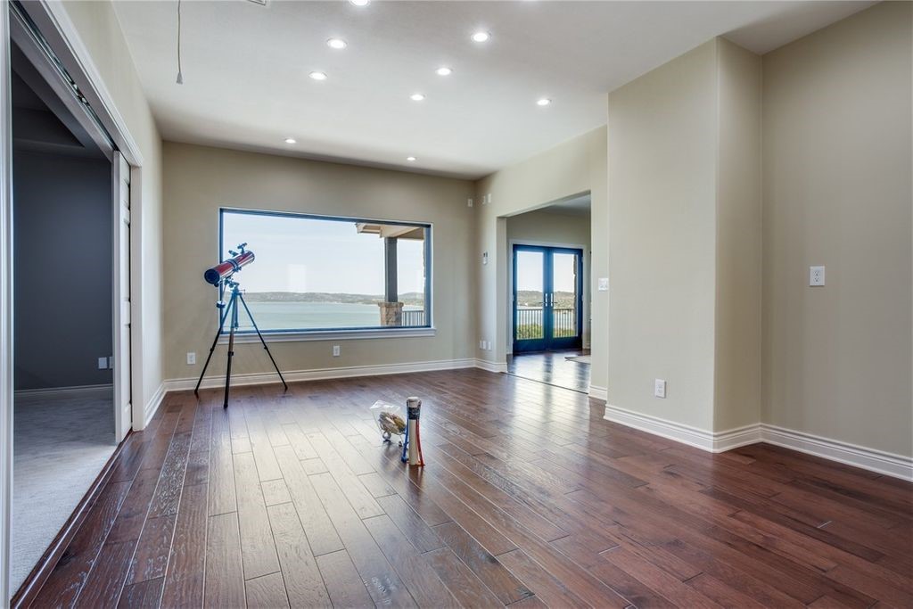 214 Peninsula Drive Burnet, TX 78611 - Photo 43 of 44 a room with wooden floors and pool table