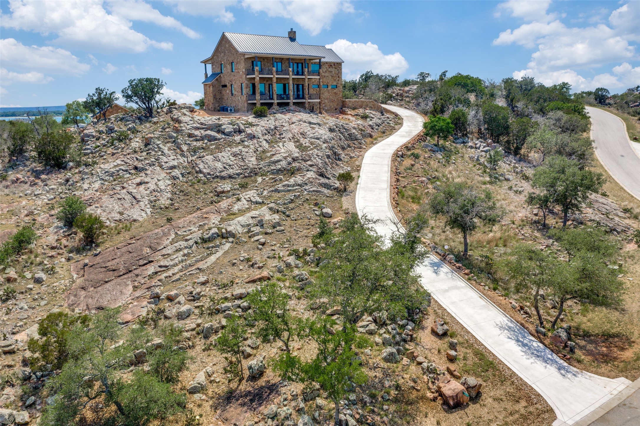 214 Peninsula Drive Burnet, TX 78611 - Photo 9 of 44 a view of a house with a yard