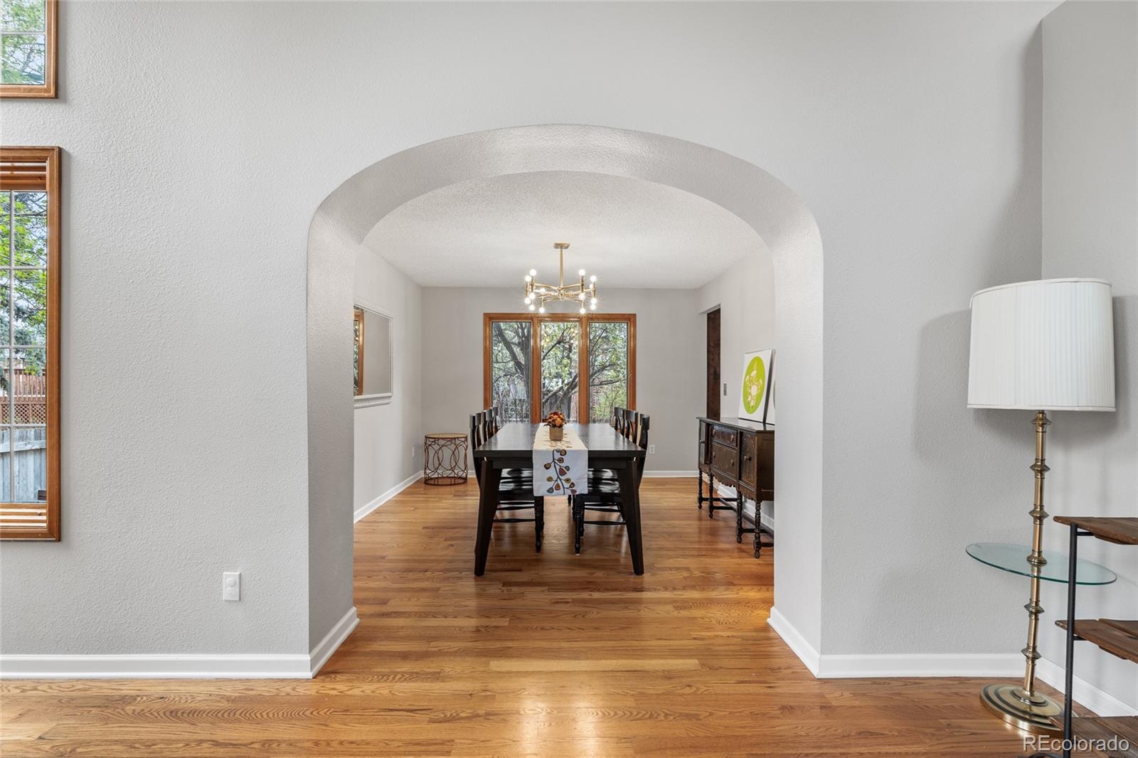 4852 South Carson Street Aurora, CO 80015 - Photo 12 of 50 a view of a dining room with furniture window and wooden floor
