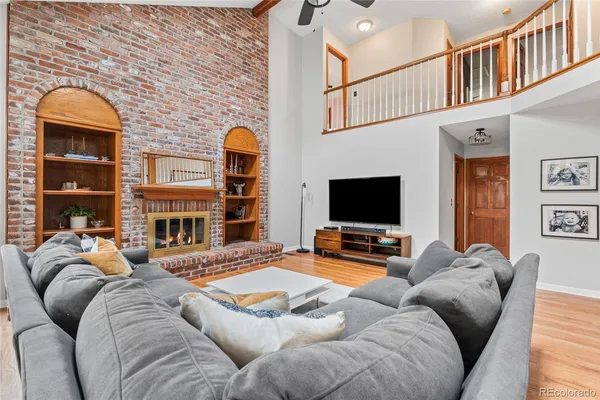 a living room with furniture fireplace and flat screen tv