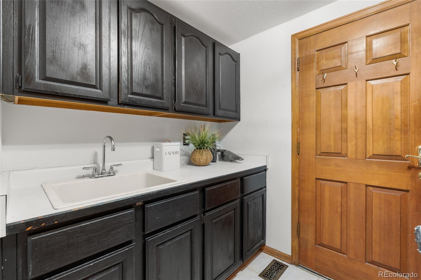 4852 South Carson Street Aurora, CO 80015 - Photo 29 of 50 a bathroom with a sink and a mirror