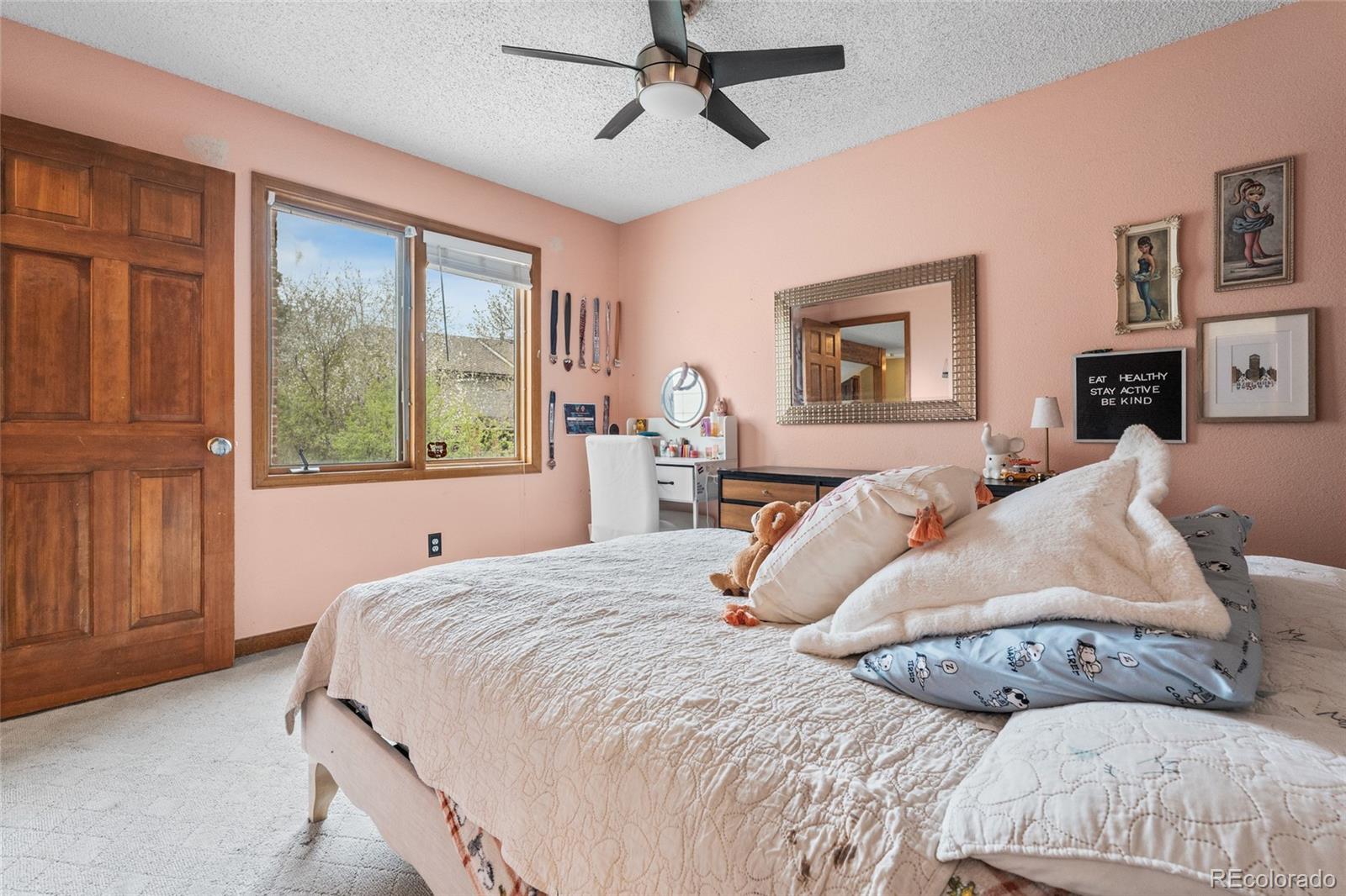 4852 South Carson Street Aurora, CO 80015 - Photo 39 of 50 a bedroom with a large bed and a window