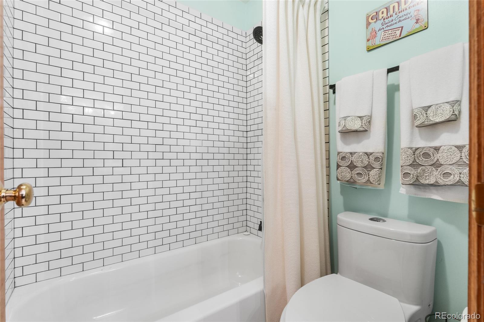 4852 South Carson Street Aurora, CO 80015 - Photo 41 of 50 a bathroom with a toilet and a shower