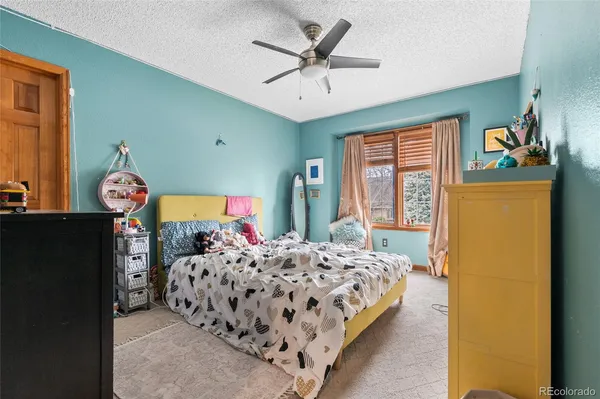 a bedroom with two beds and a window