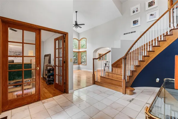a view of entryway and hall with wooden floor
