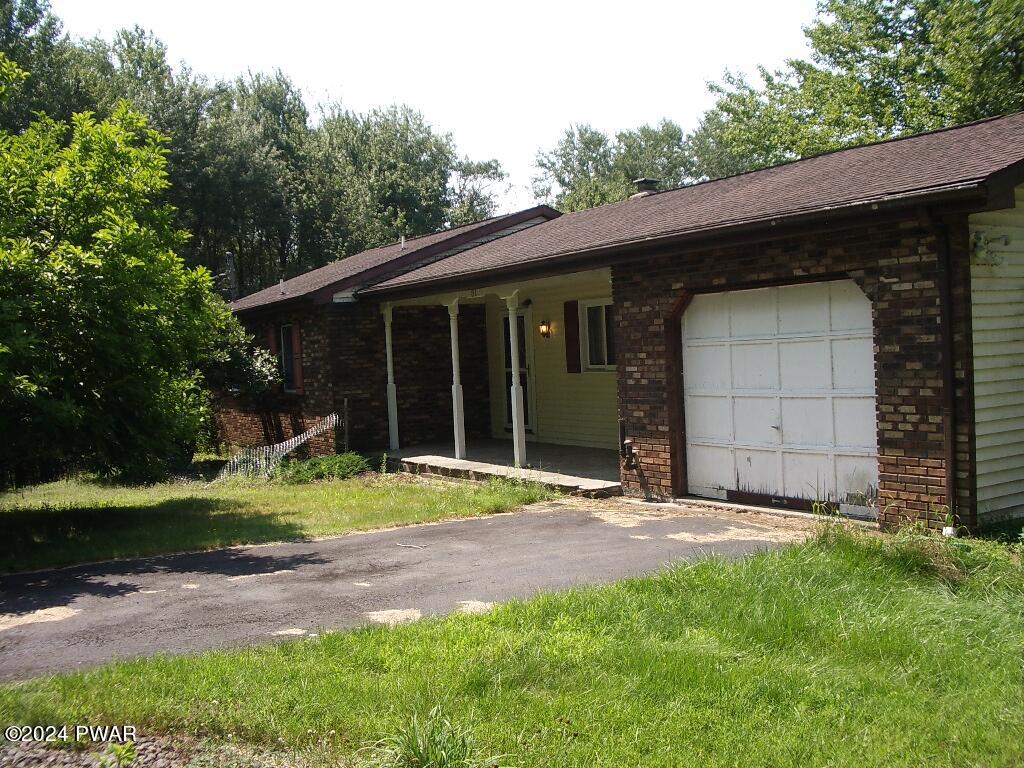 81 Tuthill Road Waymart, PA 18472 - Photo 2 of 29 a view of a barn house and a yard