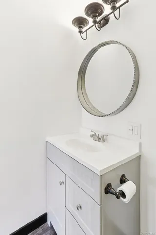 a bathroom with a sink and mirror