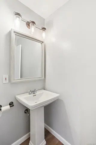 a bathroom with a sink a mirror and a vanity