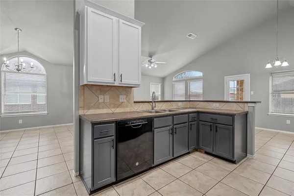 a kitchen with stainless steel appliances granite countertop a stove and a sink