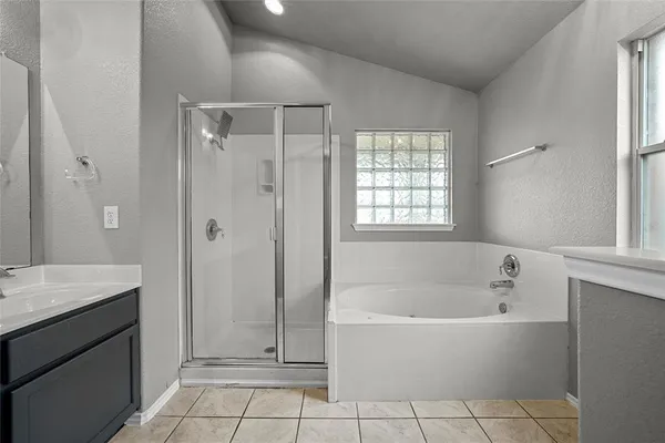 a bathroom with a bathtub and a sink