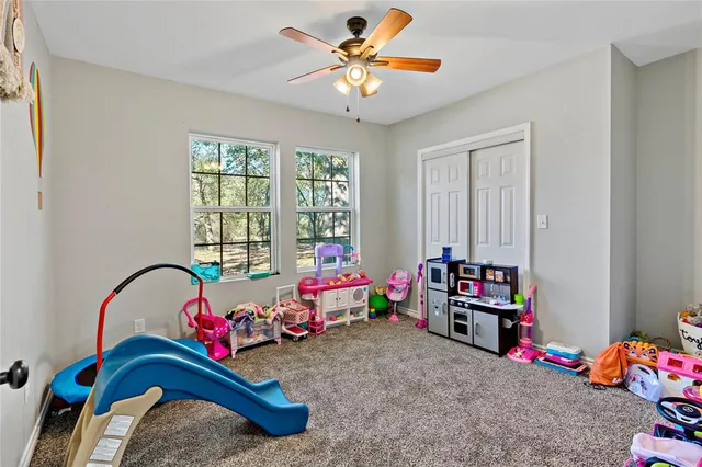 a bedroom with furniture and a chandelier