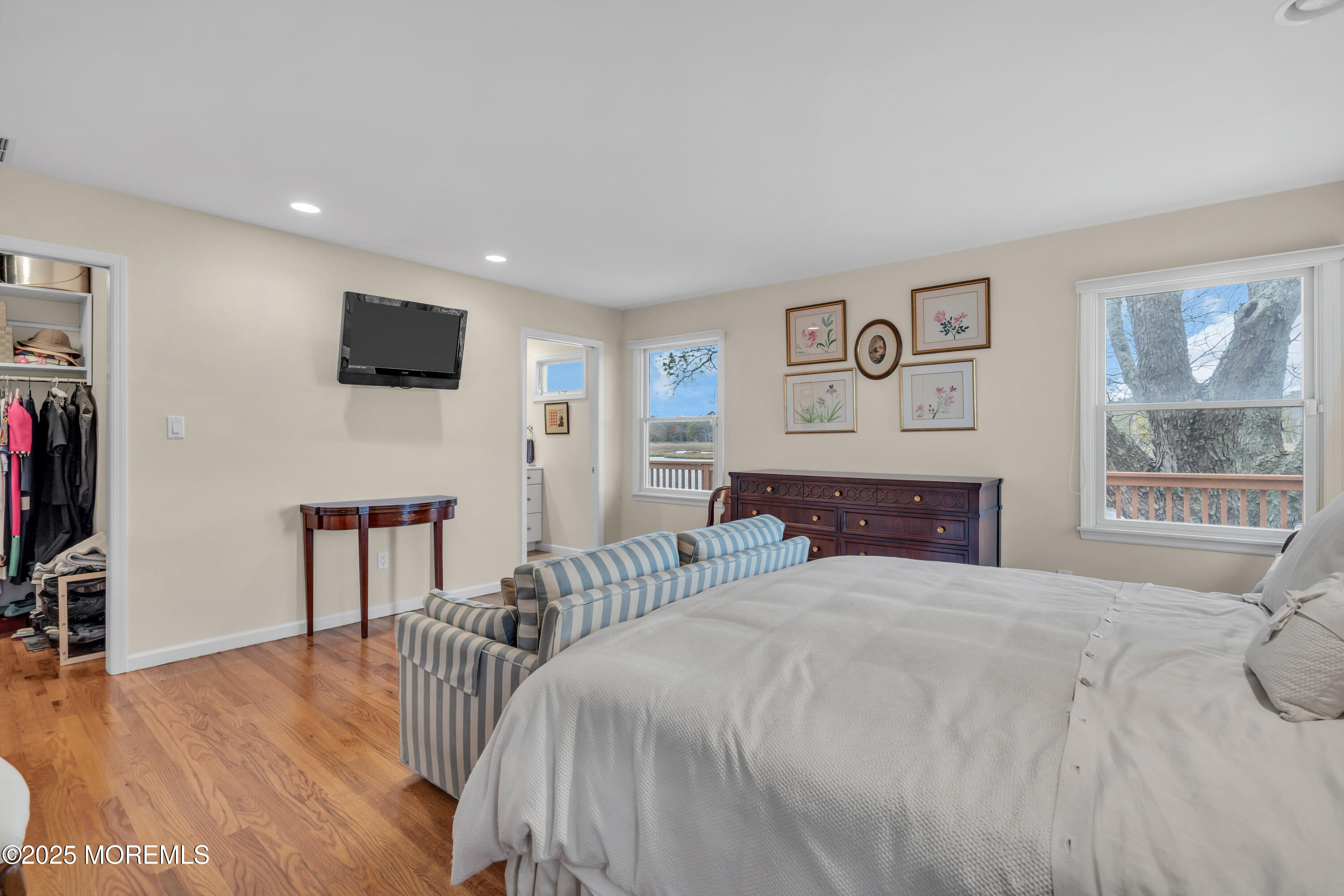 607 Ranger Drive Forked River, NJ 08731 - Photo 11 of 38 a bedroom with a bed and a flat screen tv
