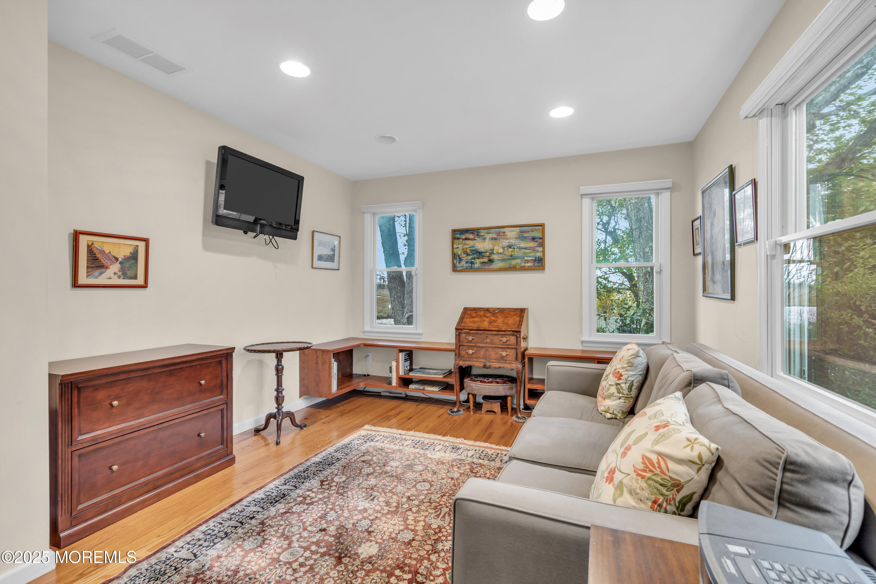 607 Ranger Drive Forked River, NJ 08731 - Photo 12 of 38 a living room with furniture and a flat screen tv