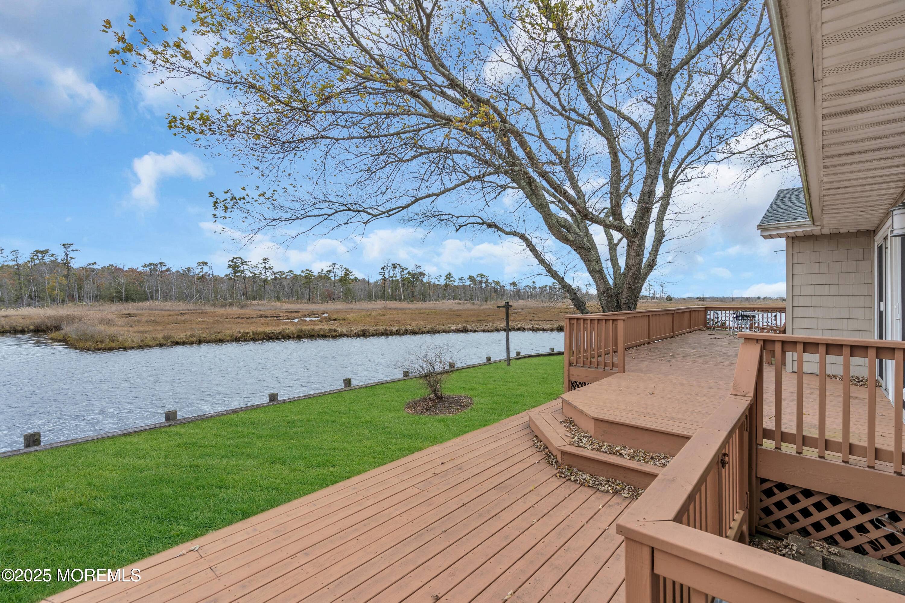 607 Ranger Drive Forked River, NJ 08731 - Photo 16 of 38 a view of a patio with wooden floor and a yard