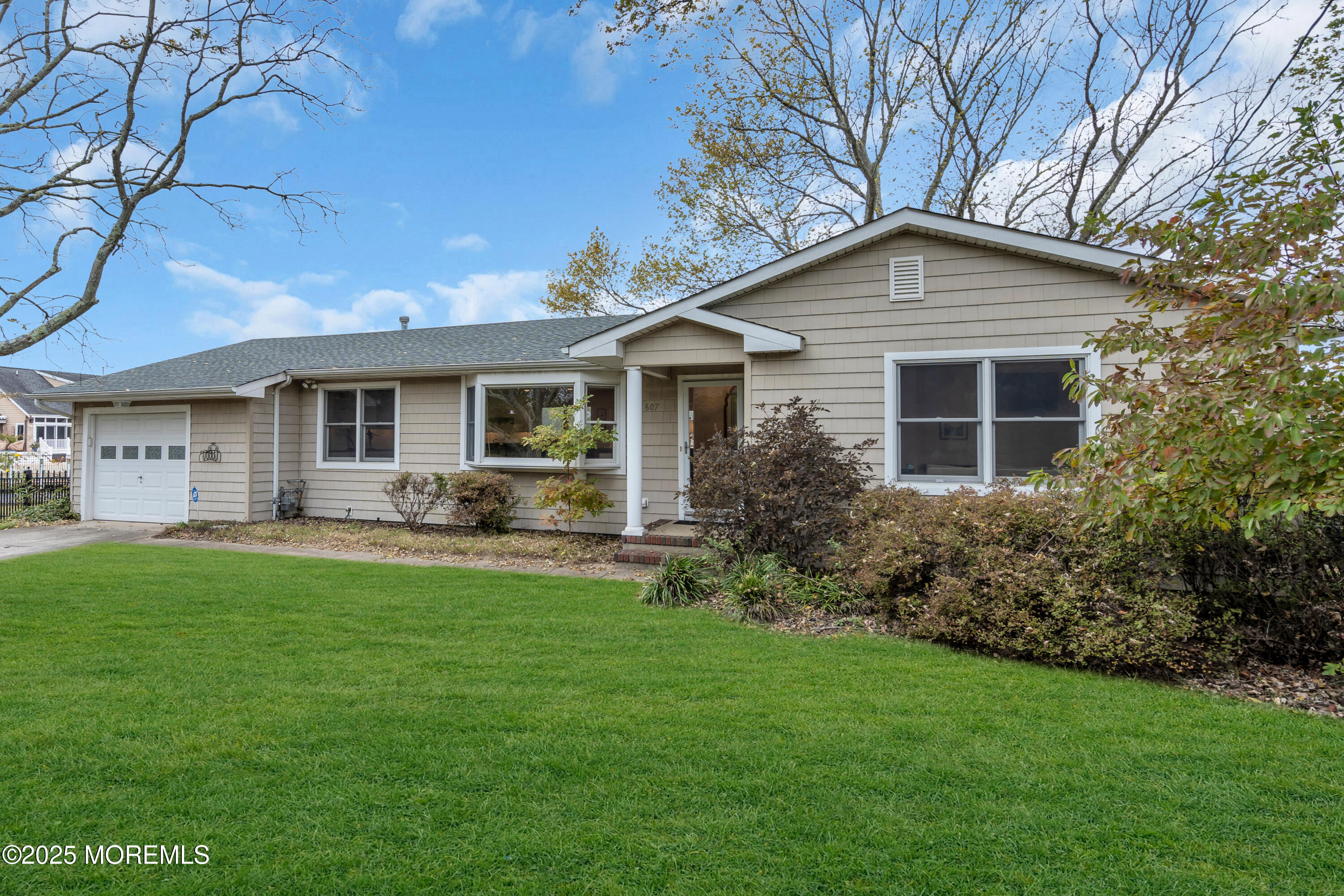 607 Ranger Drive Forked River, NJ 08731 - Photo 3 of 38 a front view of house with yard and green space
