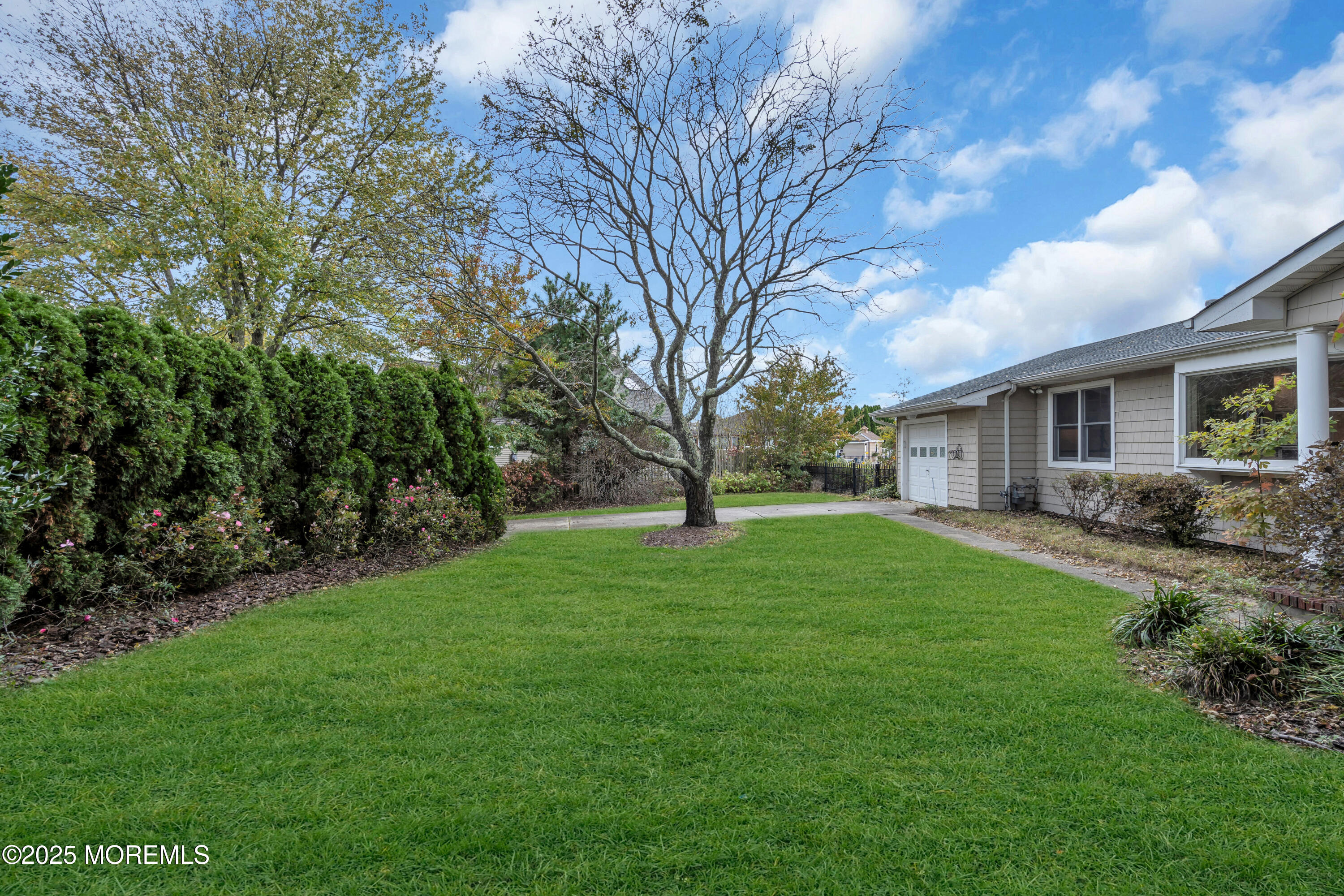 607 Ranger Drive Forked River, NJ 08731 - Photo 5 of 38 a view of a yard with a house and garden