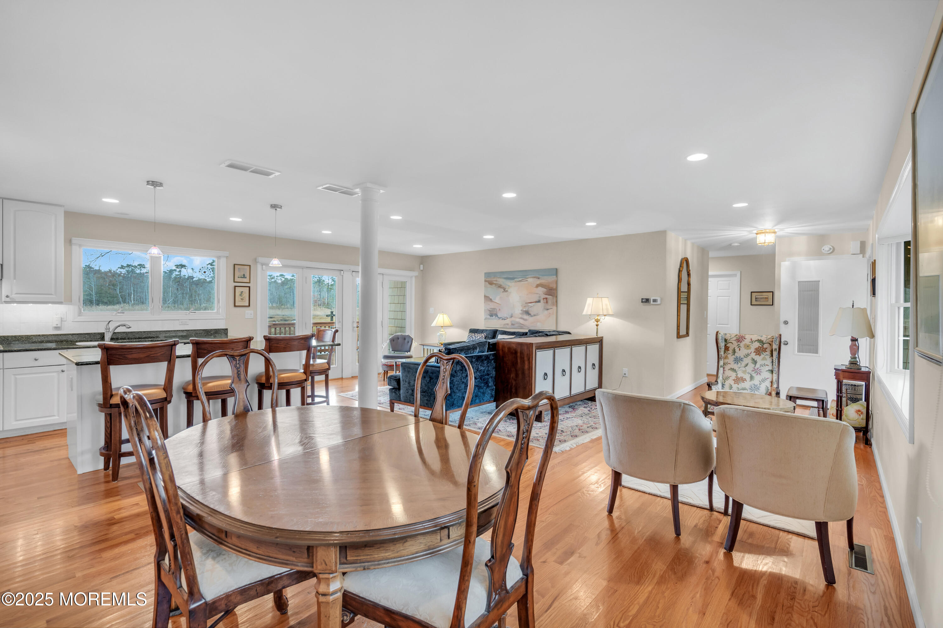 607 Ranger Drive Forked River, NJ 08731 - Photo 9 of 38 a dining room with furniture and wooden floor