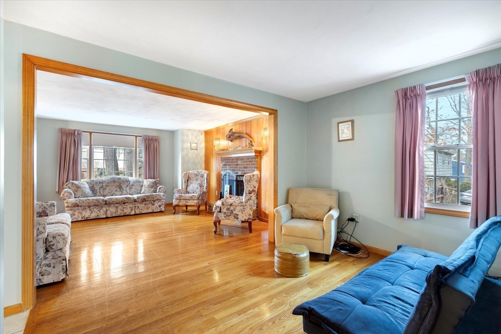 195 High Street Randolph, MA 02368 - Photo 11 of 42 a living room with furniture and wooden floor