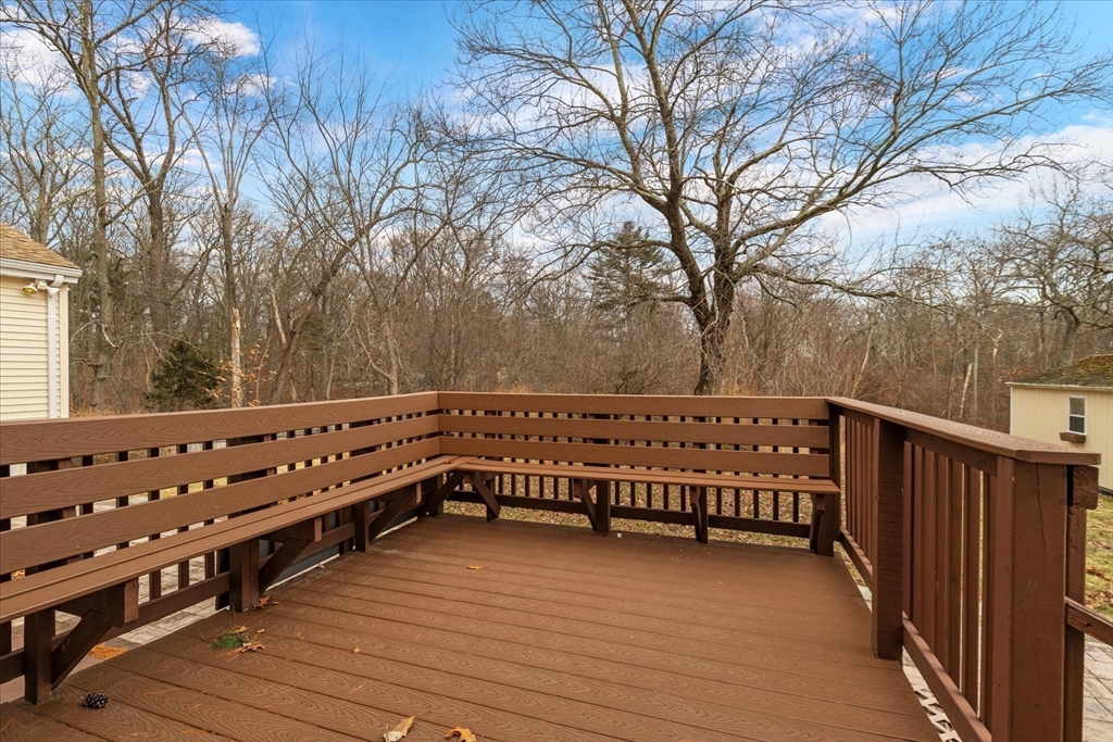 195 High Street Randolph, MA 02368 - Photo 40 of 42 a view of a wooden deck with trees in the background