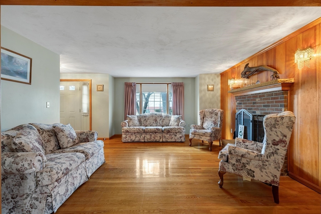 195 High Street Randolph, MA 02368 - Photo 9 of 42 a living room with furniture and a fireplace