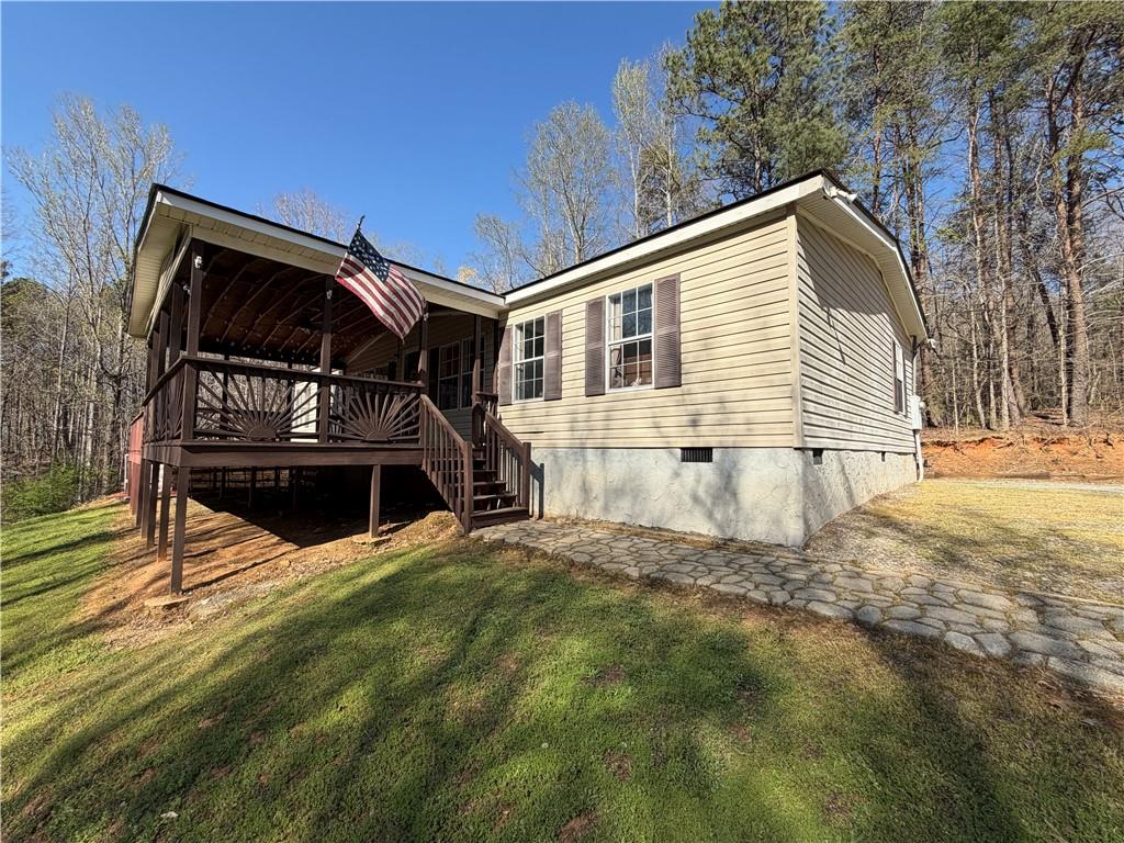 13298 Highway 53 Fairmount, GA 30139 - Photo 1 of 1 a view of house with backyard and trees
