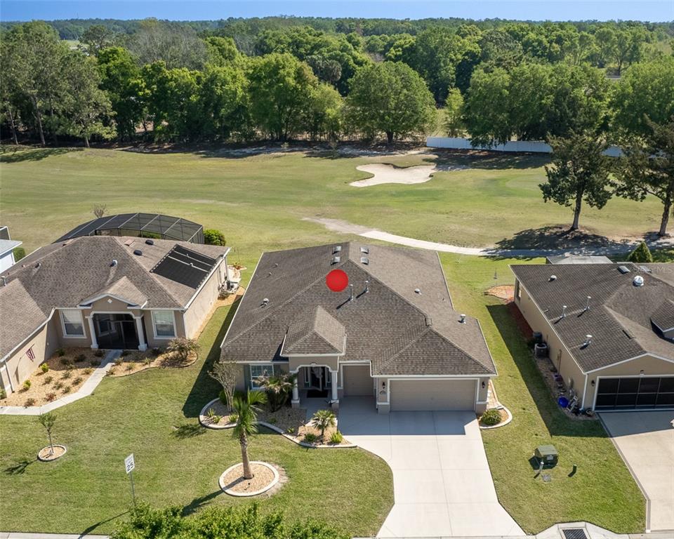 16123 Southwest 14th Avenue Road Ocala, FL 34473 - Photo 1 of 65 an aerial view of a house with a swimming pool