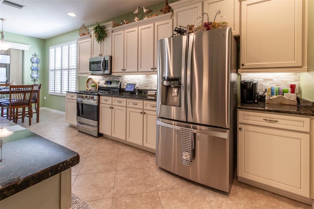 16123 Southwest 14th Avenue Road Ocala, FL 34473 - Photo 18 of 65 a kitchen with appliances a sink and cabinets