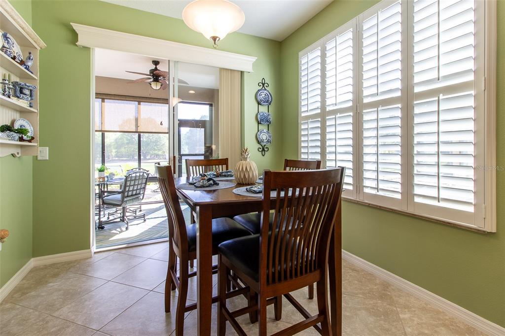 16123 Southwest 14th Avenue Road Ocala, FL 34473 - Photo 21 of 65 a view of a dining room with furniture and a window