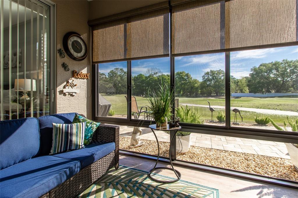 16123 Southwest 14th Avenue Road Ocala, FL 34473 - Photo 26 of 65 a view of a living room with furniture and floor to ceiling window