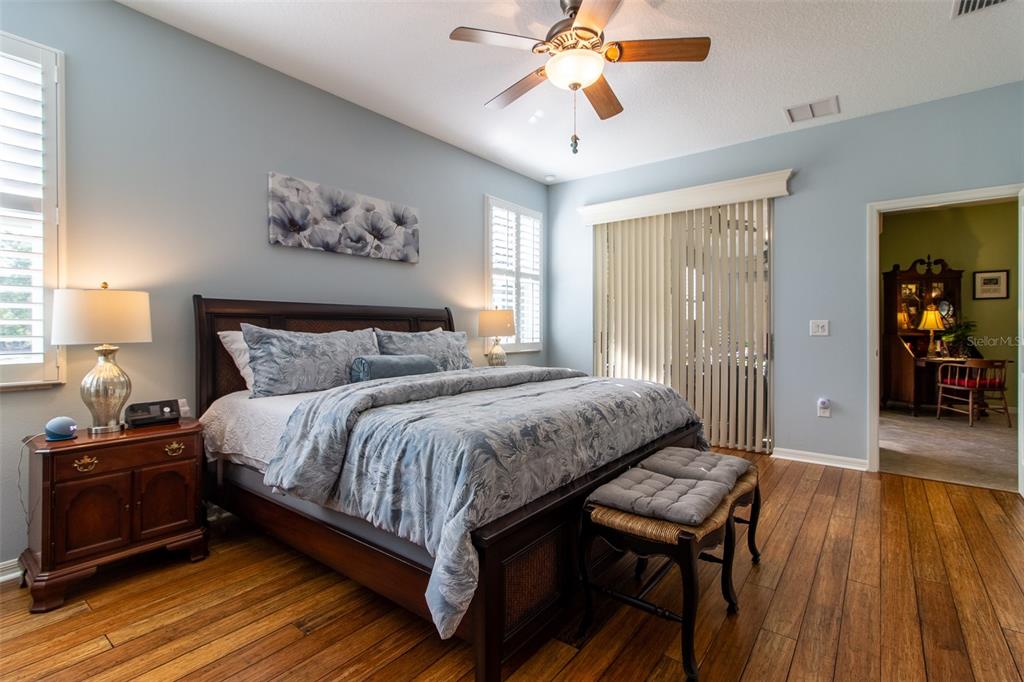 16123 Southwest 14th Avenue Road Ocala, FL 34473 - Photo 27 of 65 a bedroom with a bed and wooden floor