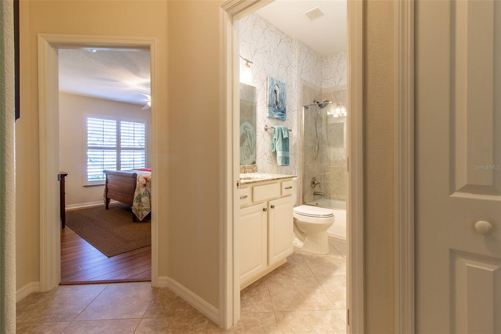 16123 Southwest 14th Avenue Road Ocala, FL 34473 - Photo 36 of 65 a en suite bathroom with a toilet shower and a mirror