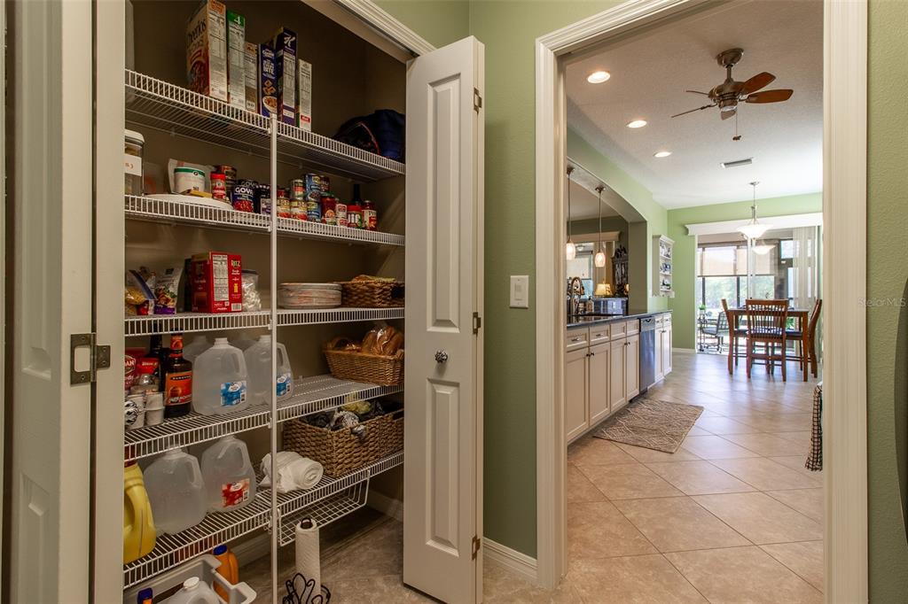 16123 Southwest 14th Avenue Road Ocala, FL 34473 - Photo 46 of 65 a room with lots of books and a view of living room