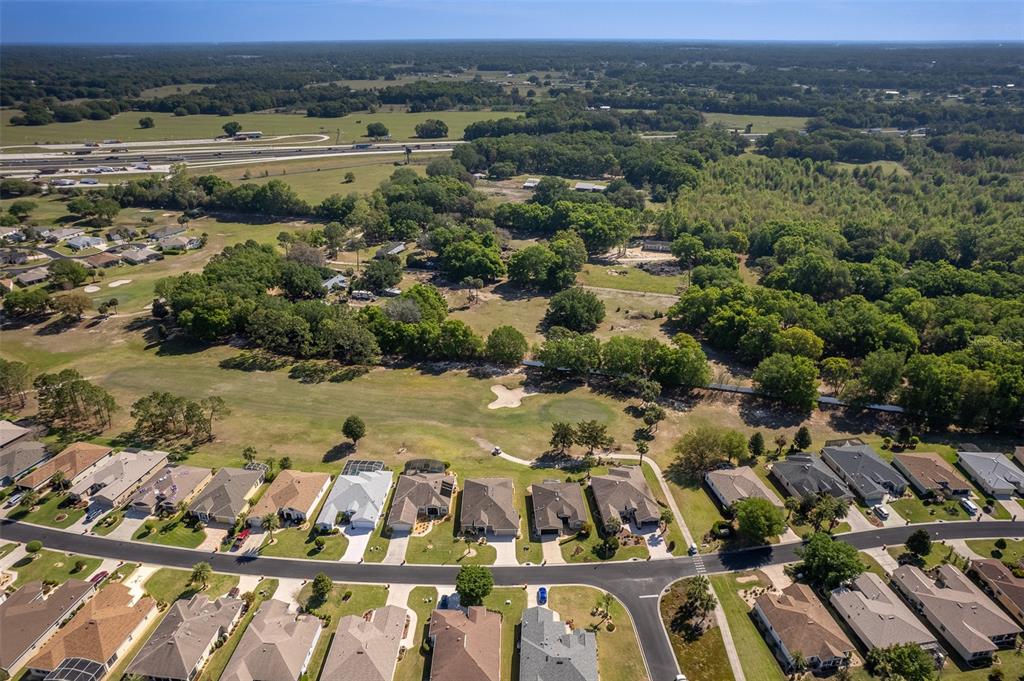16123 Southwest 14th Avenue Road Ocala, FL 34473 - Photo 61 of 65 an aerial view of residential houses with outdoor space
