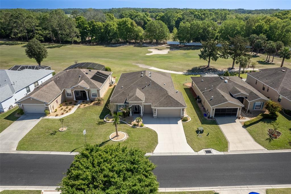 16123 Southwest 14th Avenue Road Ocala, FL 34473 - Photo 64 of 65 an aerial view of a house with outdoor space lake view and large trees