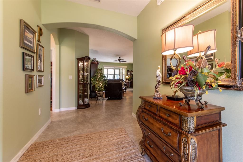 16123 Southwest 14th Avenue Road Ocala, FL 34473 - Photo 7 of 65 a living room with furniture and a flat screen tv