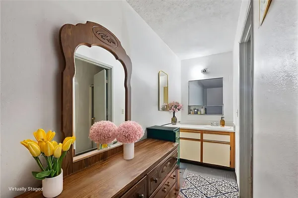a view of bathroom with dual sinks