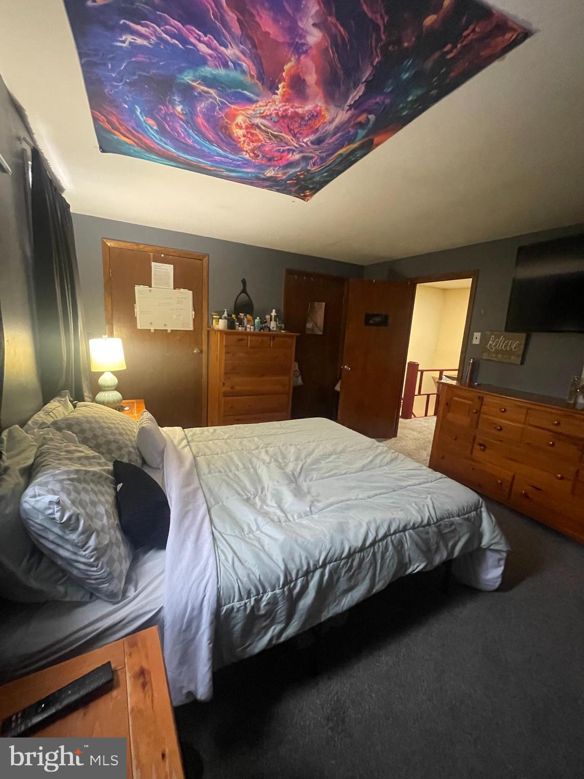 12123 Rambler Road Philadelphia, PA 19154 - Photo 16 of 29 a bedroom with a bed and mirror