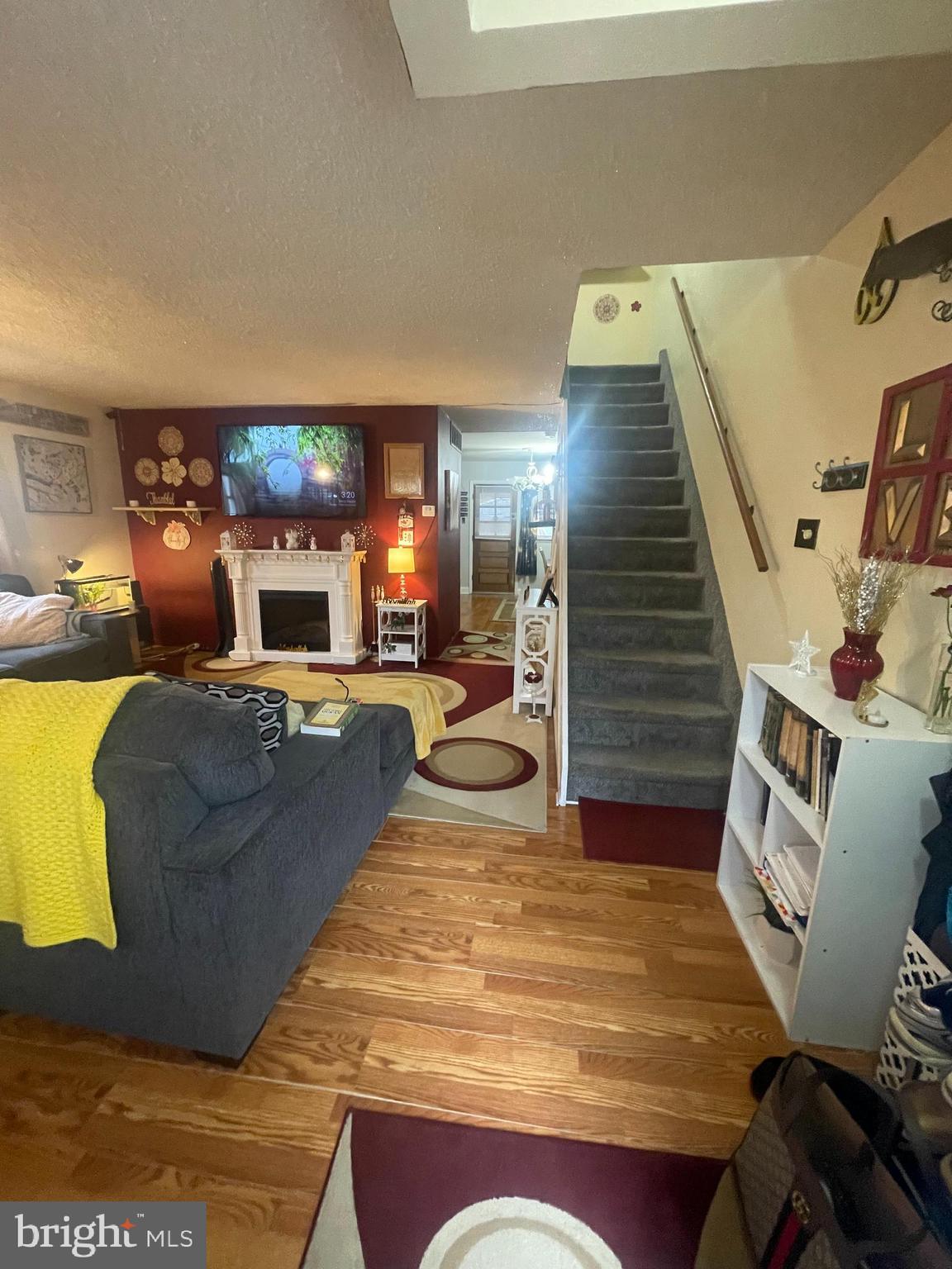 12123 Rambler Road Philadelphia, PA 19154 - Photo 5 of 29 a living room with furniture and a fireplace