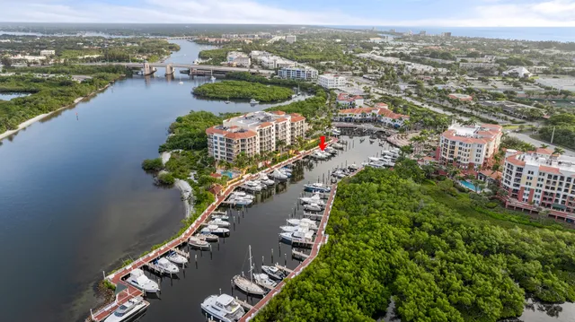 an aerial view of a house with a lake view