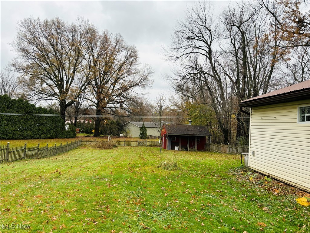3195 Mayfair Road Akron, OH 44312 - Photo 4 of 8 large yard with shed in the back, it has electric in it too