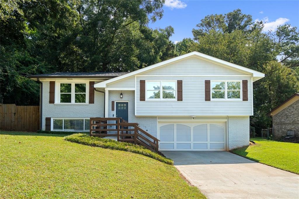 2256 Greenway Drive Decatur, GA 30035 - Photo 1 of 1 a front view of a house with a yard outdoor seating and yard