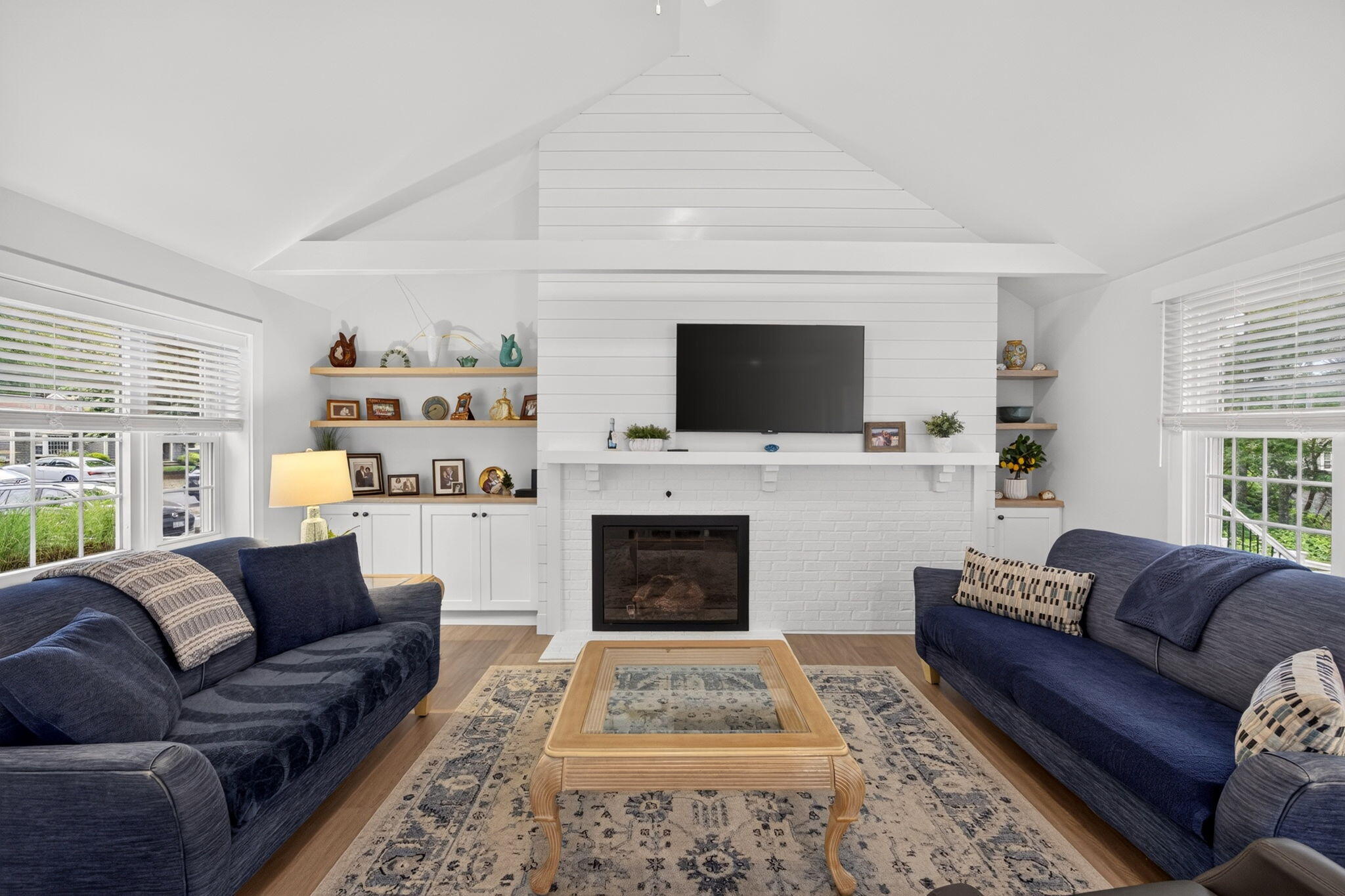 35 Debs Hill Road, Unit 35 Yarmouth Port, MA 02675 - Photo 5 of 36 a living room with furniture a flat screen tv and a fireplace