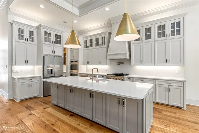 a kitchen with a sink cabinets and window