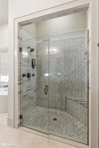 a bathroom with a bathtub and a window